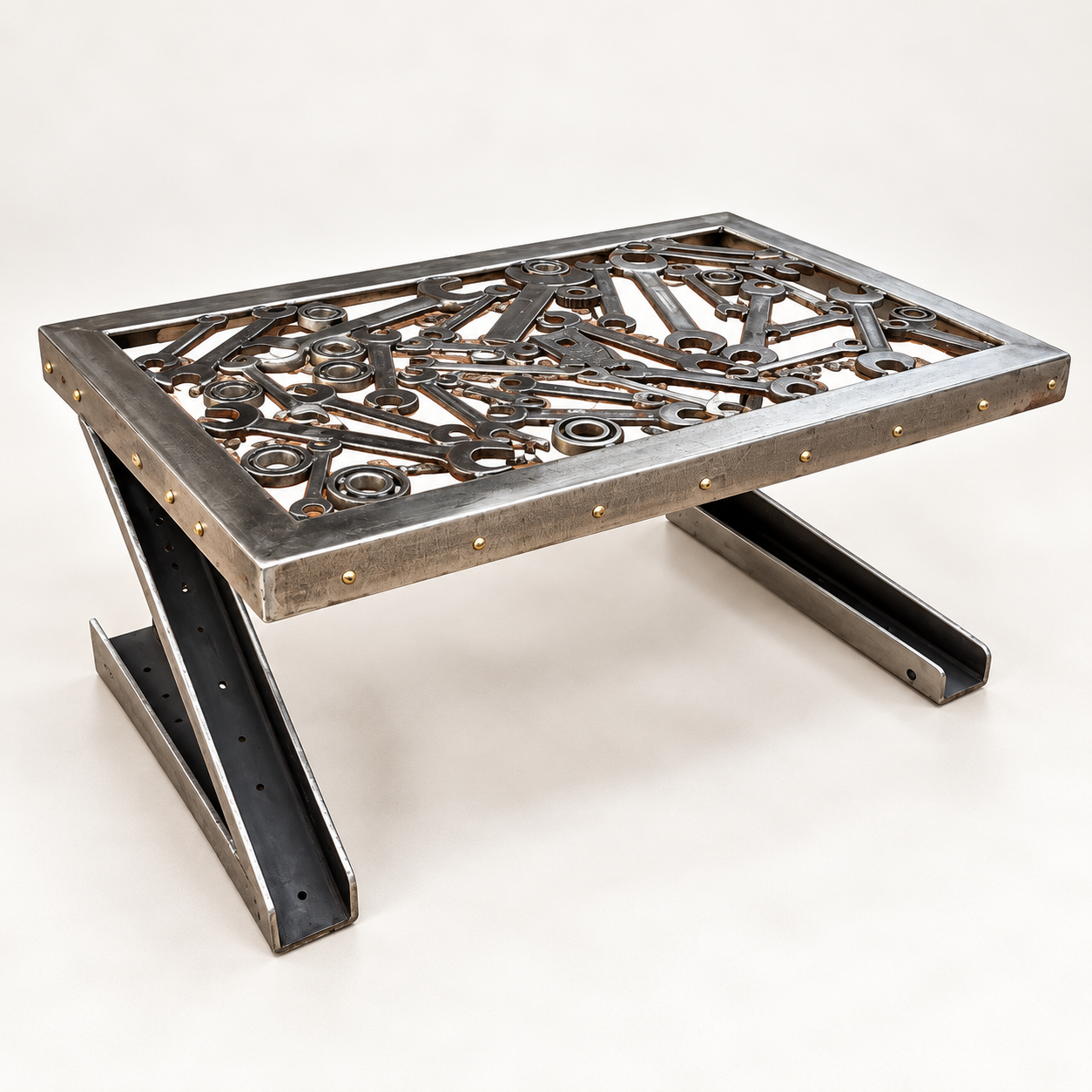 Industrial coffee table made from reclaimed tools, bearings and steel